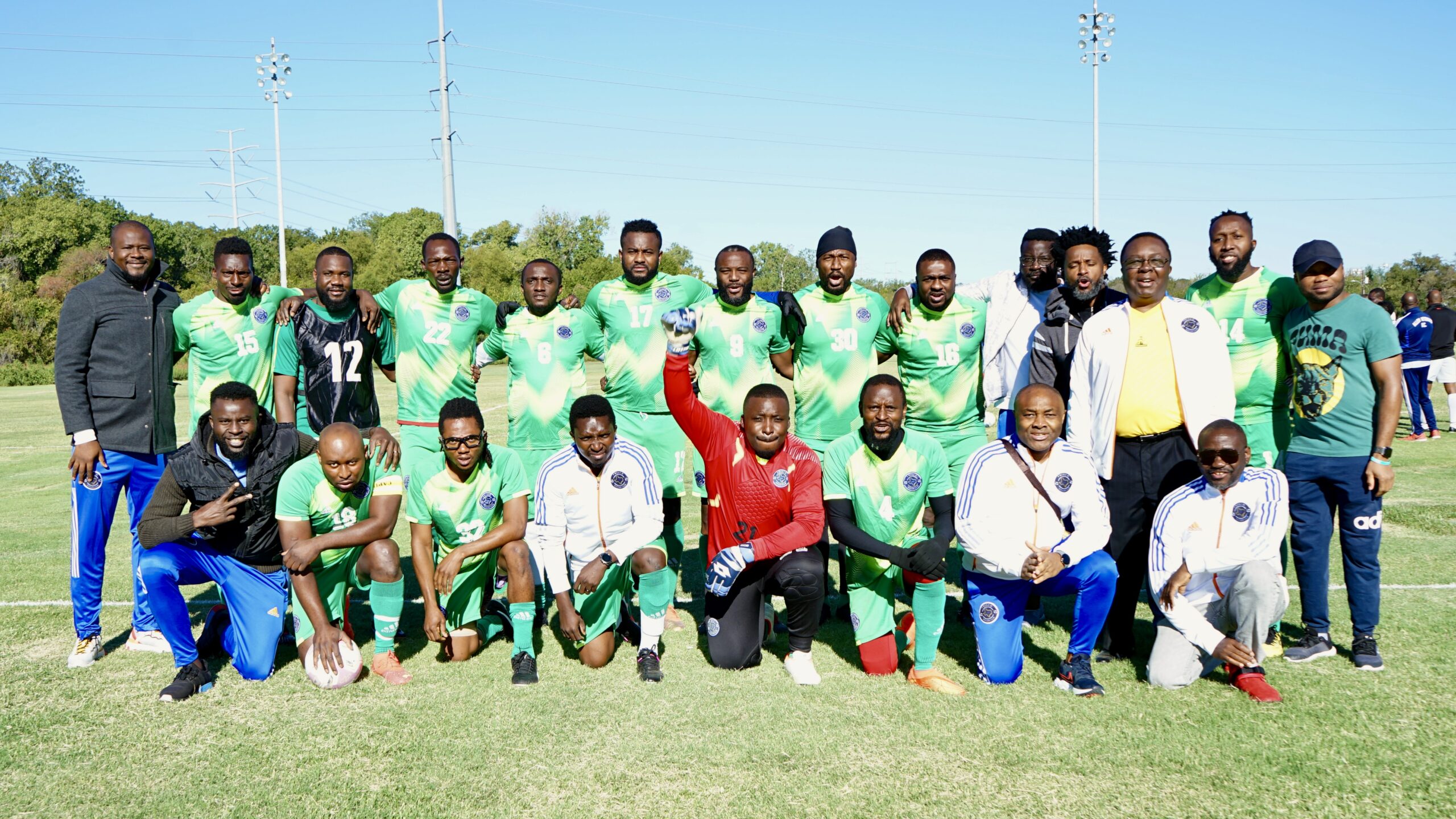 Frisco Soccer Club team holding a banner